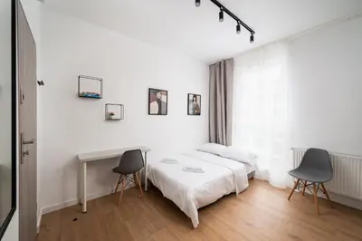 Łóżko lub łóżka w pokoju w obiekcie Nowa Praga Modern Apartment