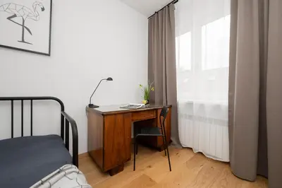 Łóżko lub łóżka w pokoju w obiekcie Charming Apartment for 4 People Located 650 m from the Old Town of Warsaw by Noclegi Renters