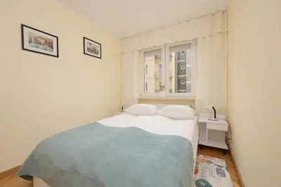 Łóżko lub łóżka w pokoju w obiekcie Sienna Cosy & Family Apartment Warsaw Center by Noclegi Renters