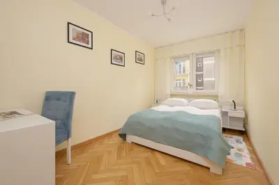 Łóżko lub łóżka w pokoju w obiekcie Sienna Cosy & Family Apartment Warsaw Center by Noclegi Renters