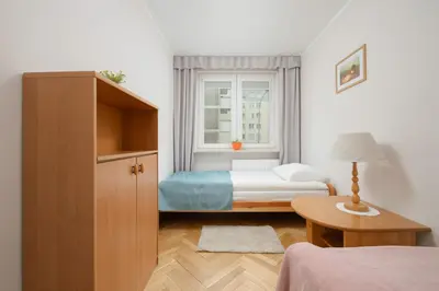 Łóżko lub łóżka w pokoju w obiekcie Sienna Cosy & Family Apartment Warsaw Center by Noclegi Renters