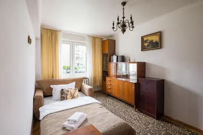 Łóżko lub łóżka w pokoju w obiekcie Wola Miła Standard Apartment by BookingHost