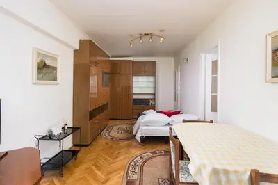 Łóżko lub łóżka w pokoju w obiekcie Wola Miła Standard Apartment by BookingHost