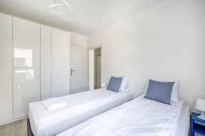 Łóżko lub łóżka w pokoju w obiekcie Labo Apartment Soho Mińska