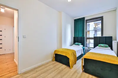 Łóżko lub łóżka w pokoju w obiekcie Kasprzaka 29C Two Separate Bedroom Free Garage By Perfect Apart
