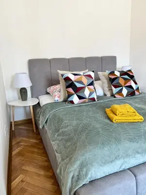 Łóżko lub łóżka w pokoju w obiekcie Apartamenty centrum
