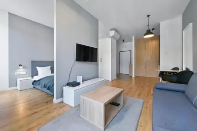 Telewizja i/lub zestaw kina domowego w obiekcie RentPlanet - Apartament Sławińska