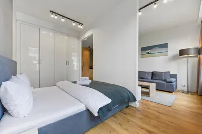Łóżko lub łóżka w pokoju w obiekcie RentPlanet - Apartament Sławińska