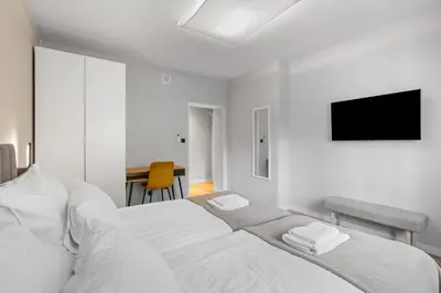 Łóżko lub łóżka w pokoju w obiekcie Apartamenty Modra Warszawa