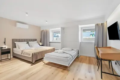 Łóżko lub łóżka w pokoju w obiekcie Apartamenty Modra Warszawa