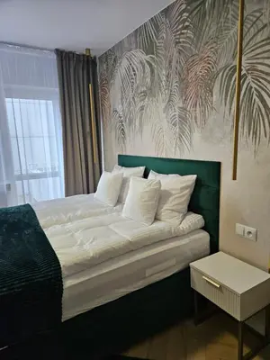 Łóżko lub łóżka w pokoju w obiekcie Apartament Deluxe Centrum Warszawa