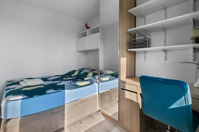 Łóżko lub łóżka w pokoju w obiekcie MokoApart Warszawa Centrum