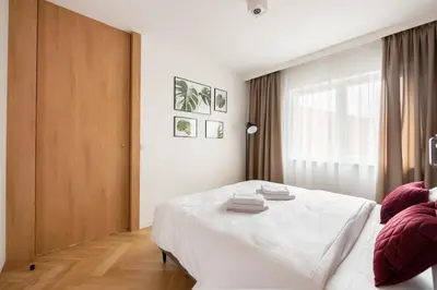 Łóżko lub łóżka w pokoju w obiekcie Wileńska Express Chic Apartment by BookingHost