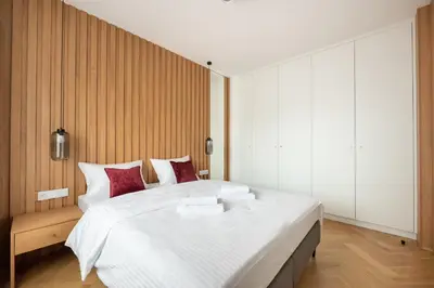 Łóżko lub łóżka w pokoju w obiekcie Wileńska Express Chic Apartment by BookingHost