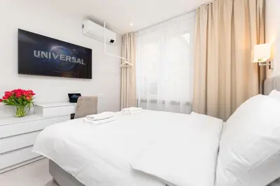 Łóżko lub łóżka w pokoju w obiekcie Apartament Krucza by Your Freedom