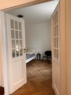 Łóżko lub łóżka w pokoju w obiekcie Apartament przy Łazienkach Królewskich