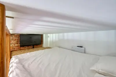 Łóżko lub łóżka w pokoju w obiekcie Industrial Apartment
