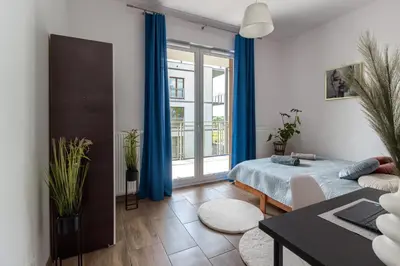 Łóżko lub łóżka w pokoju w obiekcie Geodezyjna '70 Cozy Rooms P2