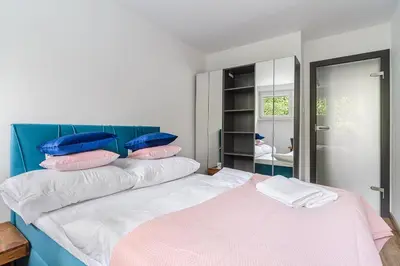 Łóżko lub łóżka w pokoju w obiekcie P&O Apartments Gierymskiego