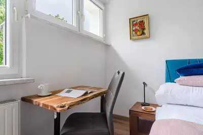 Łóżko lub łóżka w pokoju w obiekcie P&O Apartments Gierymskiego