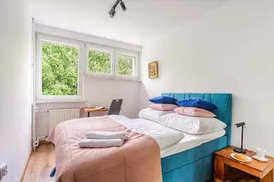 Łóżko lub łóżka w pokoju w obiekcie P&O Apartments Gierymskiego