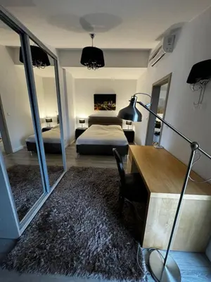 Łóżko lub łóżka w pokoju w obiekcie Apartament Rondo Daszyńskiego
