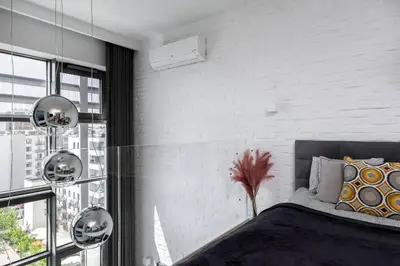 Łóżko lub łóżka w pokoju w obiekcie Purple Haze Woronicza Premium Loft Apartment