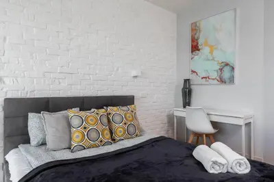Łóżko lub łóżka w pokoju w obiekcie Purple Haze Woronicza Premium Loft Apartment