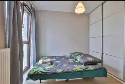 Łóżko lub łóżka w pokoju w obiekcie Airport Apartament Bokserska