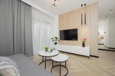 Telewizja i/lub zestaw kina domowego w obiekcie Przytulny Apartament z Parkingiem i Tarasem w Warszawie by Noclegi Renters