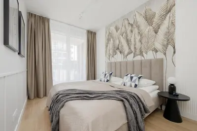 Łóżko lub łóżka w pokoju w obiekcie Luxurious Apartments in Warsaw with Sauna and Gym by Renters Prestige