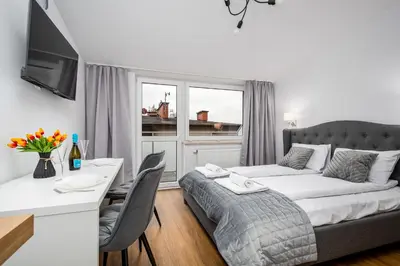 Łóżko lub łóżka w pokoju w obiekcie Pileckiego Residence