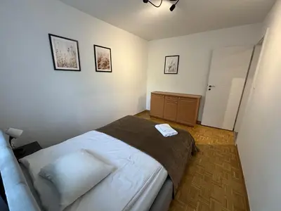 Łóżko lub łóżka w pokoju w obiekcie Music Life Apartment