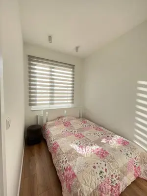 Łóżko lub łóżka w pokoju w obiekcie Apartamenty M1 z parkingiem podziemnym