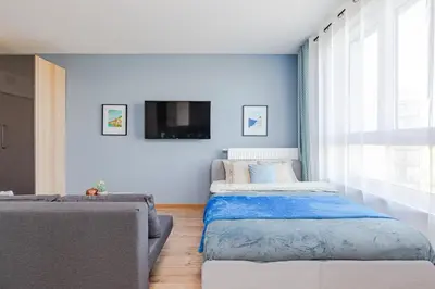 Łóżko lub łóżka w pokoju w obiekcie Wiktoryn 98 SuperApart - Nowoczesne studio