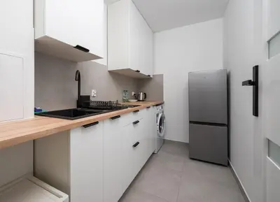 Kuchnia lub aneks kuchenny w obiekcie Ochota Comfort Apartment by BookingHost