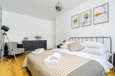 Łóżko lub łóżka w pokoju w obiekcie P&O Apartments Suwalska