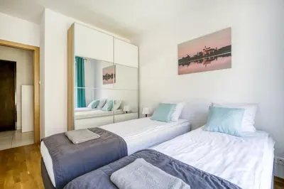 Łóżko lub łóżka w pokoju w obiekcie Labo Apartment Kamionek