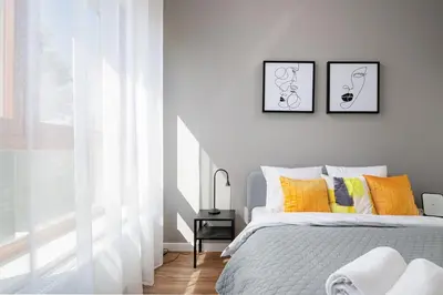 Łóżko lub łóżka w pokoju w obiekcie RentPlanet - Apartament Ludwiki