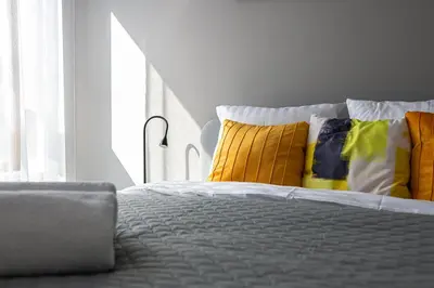 Łóżko lub łóżka w pokoju w obiekcie RentPlanet - Apartament Ludwiki