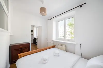 Łóżko lub łóżka w pokoju w obiekcie Plac Wilsona Comfort Apartment by BookingHost