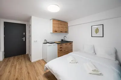 Łóżko lub łóżka w pokoju w obiekcie Pole Mokotowskie Comfort Studio by BookingHost
