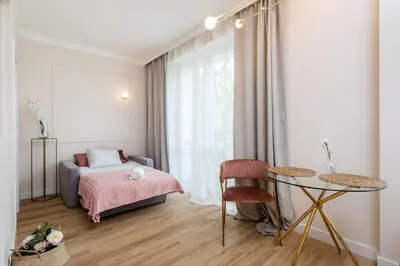 Łóżko lub łóżka w pokoju w obiekcie Olive Apartment Ochota