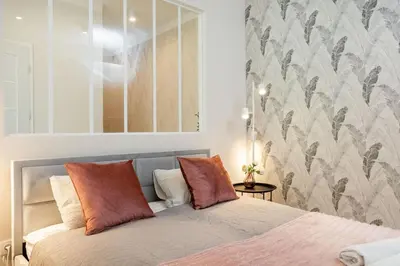Łóżko lub łóżka w pokoju w obiekcie Olive Apartment Ochota