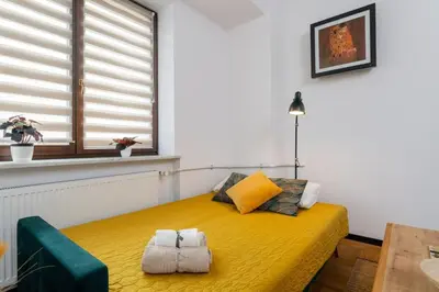 Łóżko lub łóżka w pokoju w obiekcie Peanut Premium Apartment Ochota