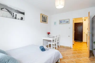 Łóżko lub łóżka w pokoju w obiekcie Cinnamon Apartment Metro Swietokrzyska