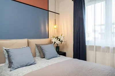 Łóżko lub łóżka w pokoju w obiekcie Deer Park Residence Mokotow