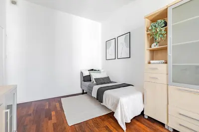 Łóżko lub łóżka w pokoju w obiekcie SuperApart Powstańców Śląskich 89B