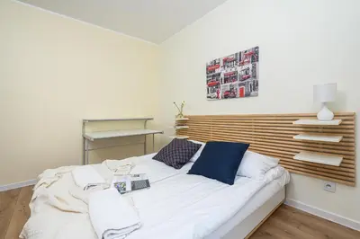 Łóżko lub łóżka w pokoju w obiekcie ShortStayPoland Wileńska B165