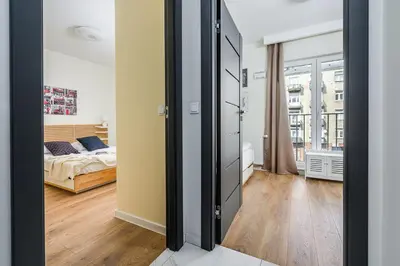 Łóżko lub łóżka w pokoju w obiekcie ShortStayPoland Wileńska B165